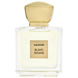 Perfume bottle labeled 'Majouri Blanc Sesame' with gold cap on a white background
